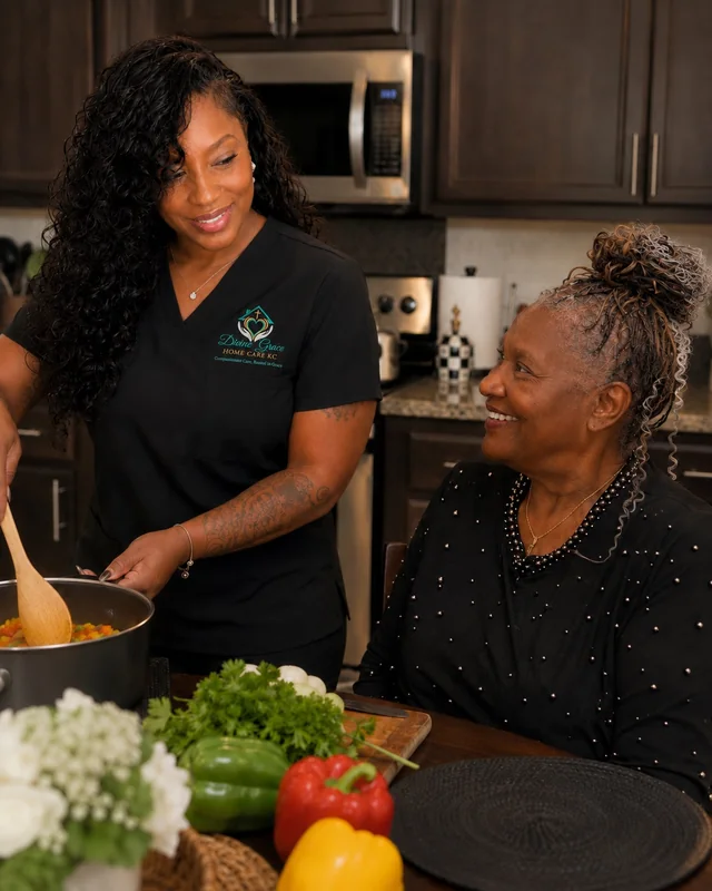 Johnna cooking a fresh meal with a client in the kitchen
